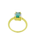 18K yellow gold ring with a baguette-cut emerald and two baguette side diamonds.