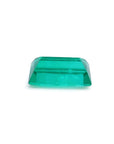 1.62 ct. baguette-cut natural emerald with vibrant green color and clear facets.