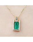 1.14 ct baguette emerald pendant necklace with natural diamonds on a 14K yellow gold chain.