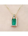 1.14 ct baguette emerald pendant necklace with natural diamonds on a 14K yellow gold chain.