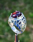 Men's 925 sterling silver ring with a striking black Ethiopian opal, showing red-orange and blue hues.