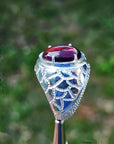 Men's black Ethiopian opal ring in 925 sterling silver with red-orange and blue hues.