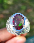 Men's black Ethiopian opal ring with red-orange and blue hues, set in ornate 925 sterling silver.