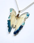 Hand-carved natural blue agate butterfly pendant necklace with sterling silver chain.