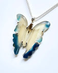 Hand-carved natural blue agate butterfly pendant necklace with sterling silver chain.