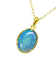 Oval 3.43 ct. Australian opal pendant with blue-green sparks in 14K yellow gold on a delicate chain.