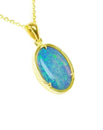 Oval 3.43 ct Australian opal pendant with blue-green sparks, handcrafted in 14K yellow gold.