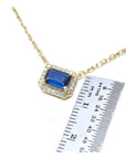 1.03 ct. natural blue sapphire necklace, emerald cut, east-west set in 14K yellow gold with diamond halo.
