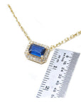 1.03 ct. natural blue sapphire necklace, emerald cut, east-west set in 14K yellow gold with diamond halo.