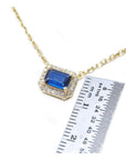 1.03 ct. natural blue sapphire necklace, emerald cut, east-west set in 14K yellow gold with diamond halo.