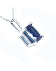 Right side profile of a solitaire blue sapphire necklace cushion cut slider pendant 14k white gold, gallery view.