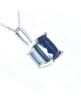 4.11 ct cushion cut deep blue sapphire solitaire pendant in 14K white gold with a four-prong setting.
