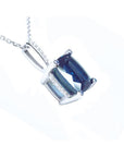 4.11 ct cushion cut deep blue sapphire solitaire pendant in 14K white gold with a four-prong setting.