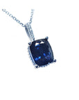 Right side top view of a solitaire blue sapphire necklace cushion cut slider pendant 14k white gold.