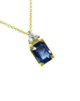 Gold necklace with a natural blue sapphire pendant emerald cut in 14k.