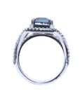 18K gold ring with a 4.51 ct emerald cut blue sapphire and a three-row diamond band.