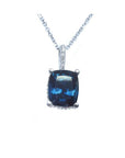 Cushion-cut blue sapphire necklace with a slider pendant, set in a four-prong basket setting of 14k white gold.