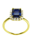 Women's 14k yellow gold ring with a rectangular emerald cut blue sapphire and diamond halo.