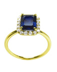 Women's 14k yellow gold ring with a rectangular emerald cut blue sapphire and diamond halo.