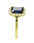 Women's 14k yellow gold ring with emerald-cut natural blue sapphire and diamond halo.
