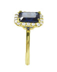 Women's 14k yellow gold ring with emerald-cut natural blue sapphire and diamond halo.