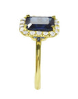 Women's 14k yellow gold ring with emerald-cut natural blue sapphire and diamond halo.