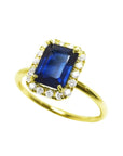Women's 14k yellow gold ring with emerald cut natural blue sapphire and diamond halo.