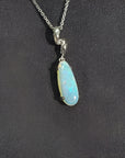 1.56 ct. bluish-green opal pendant in an elongated pear shape, set in 14K white gold on a silver chain.