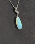 1.56 ct. bluish-green opal pendant in an elongated pear shape, set in 14K white gold on a silver chain.