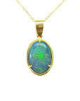 Opal pendant with gold frame on a topside view position.