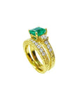 Displaying a bridal wedding band and the matching emerald ring together side profile.