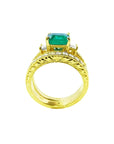 14K yellow gold bridal emerald ring set with matching engraved wedding band and princess cut side diamonds.