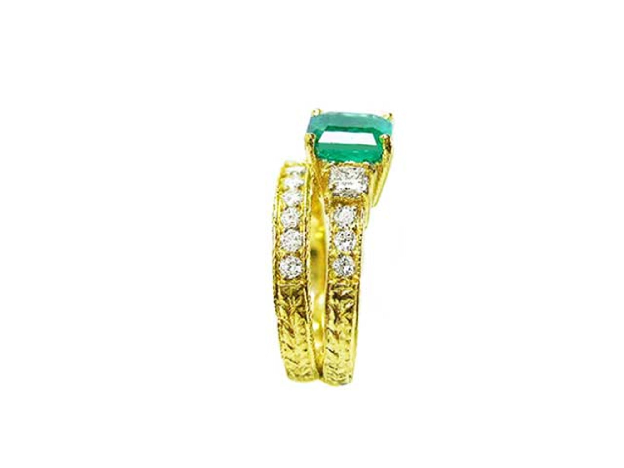 The side view of a bridal emerald ring and matching band, showing the top gemstone and side profiles.