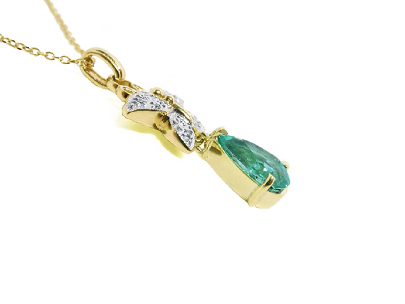 Gold necklace with a genuine emerald gemstone pendant on a right profile display.