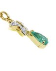 Gold necklace with a genuine emerald gemstone pendant on a right profile display.