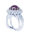 Red purple cabochon star ruby women's ring half-side top view in a double halo natural diamonds