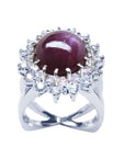 Red purple cabochon star ruby women's ring front high top view in a double halo natural diamonds
