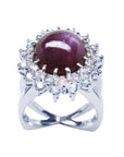 Red purple cabochon star ruby women's ring front high top view in a double halo natural diamonds