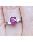 Women's 1.59 ct Burma Ruby ring with trillion side diamonds in 14k white gold.