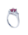14k white gold ring with a deep red ruby and trillion side diamonds.