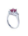 14k white gold ring with a deep red ruby and trillion side diamonds.