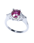 Certified oval ruby women's ring side trillion cut diamonds 14k white gold, tilted top view perspective shoulders and sank