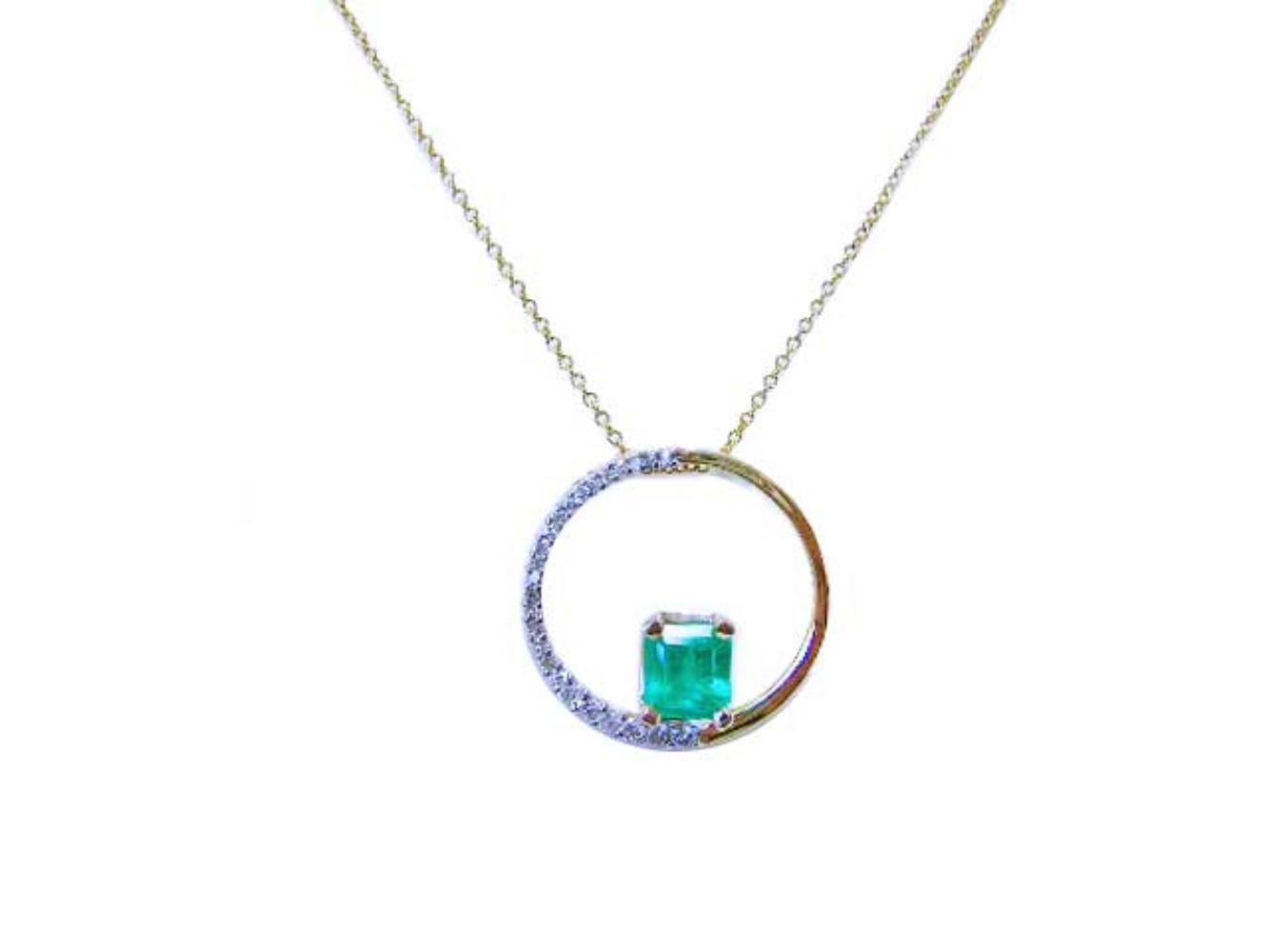 Necklace with a square natural emerald in a circle of life pendant gold and diamond.