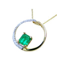 1.08 ct. emerald pendant in 14K gold, with a diamond pavé and polished band "Circle of Life" design.