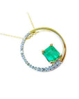 The circle of life with a genuine Colombian emerald pendant necklace, topside view, half diamonds and half gold.