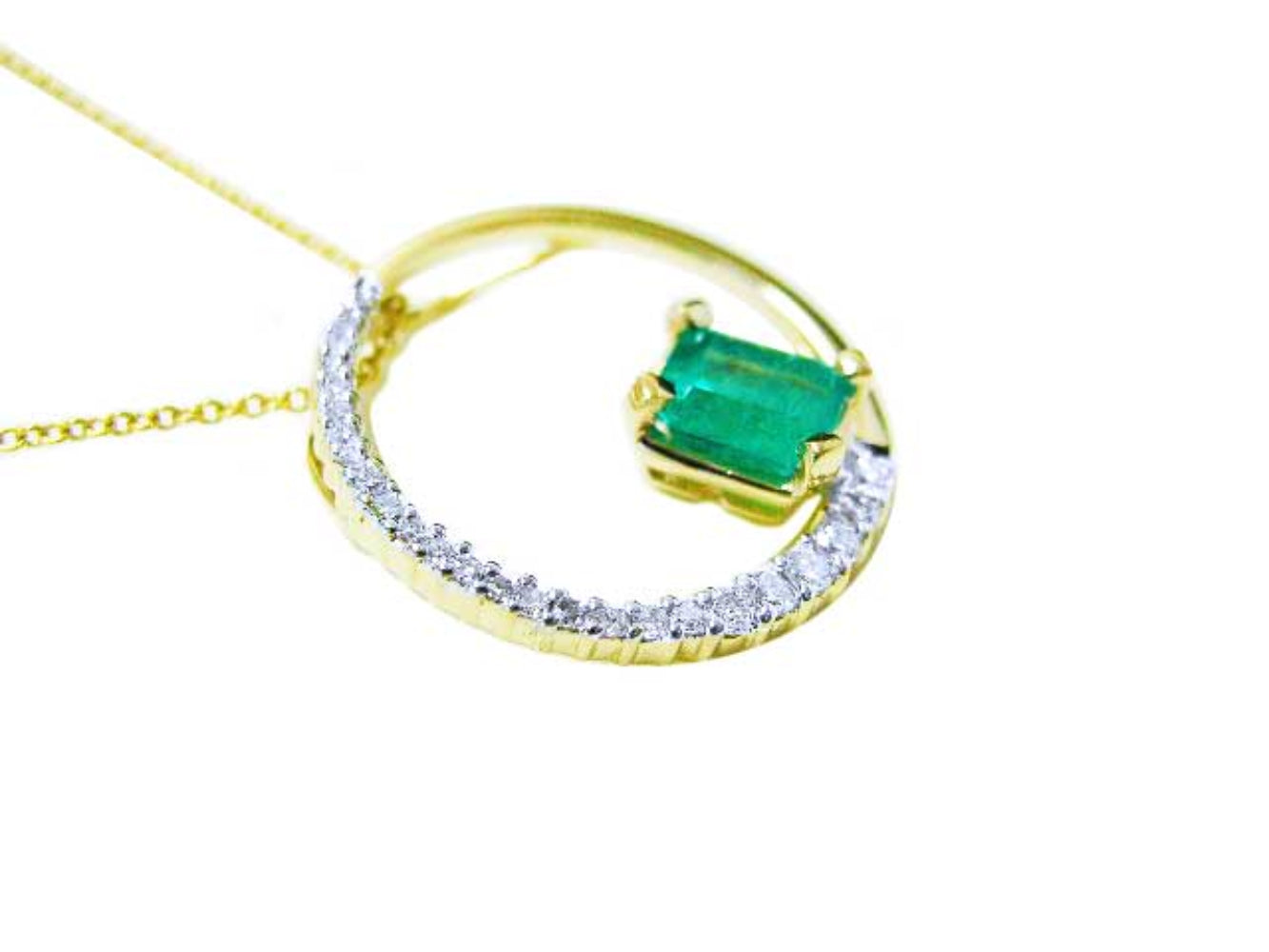 Gold necklace with a genuine colombian emerald pendant meaning the circle of life.
