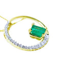 Gold necklace with a genuine colombian emerald pendant meaning the circle of life.