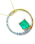 The circle of life with a genuine Colombian emerald pendant necklace, topside view, half diamonds and half gold.