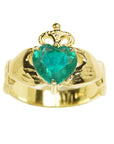 This heart emerald claddagh ring for women displays the topside profile on a white background.