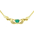 14K yellow gold Claddagh necklace with a deep green heart-cut emerald.